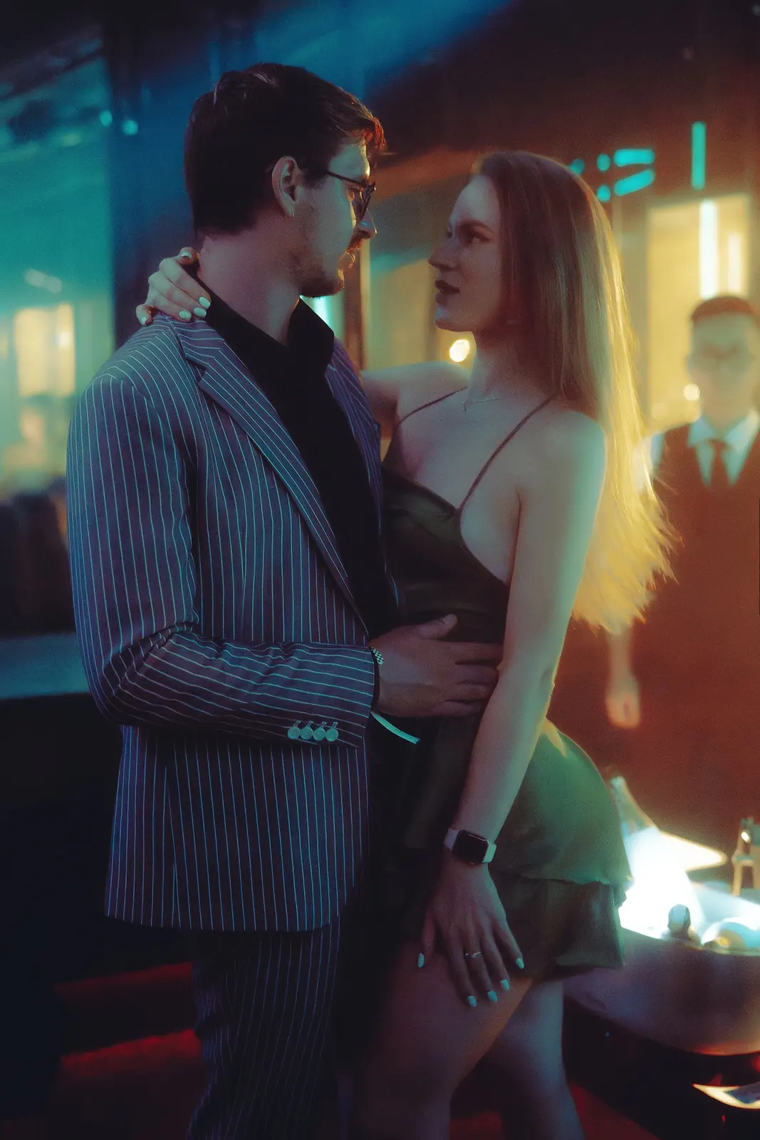 Illustrative stock image of an adult couple flirting at a nightclub bar